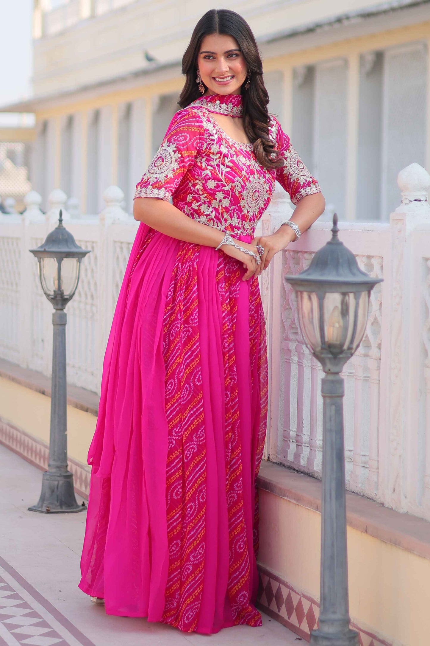 Tantalizing Rani Pink Bandhej Print Georgette Gown With Dupatta
