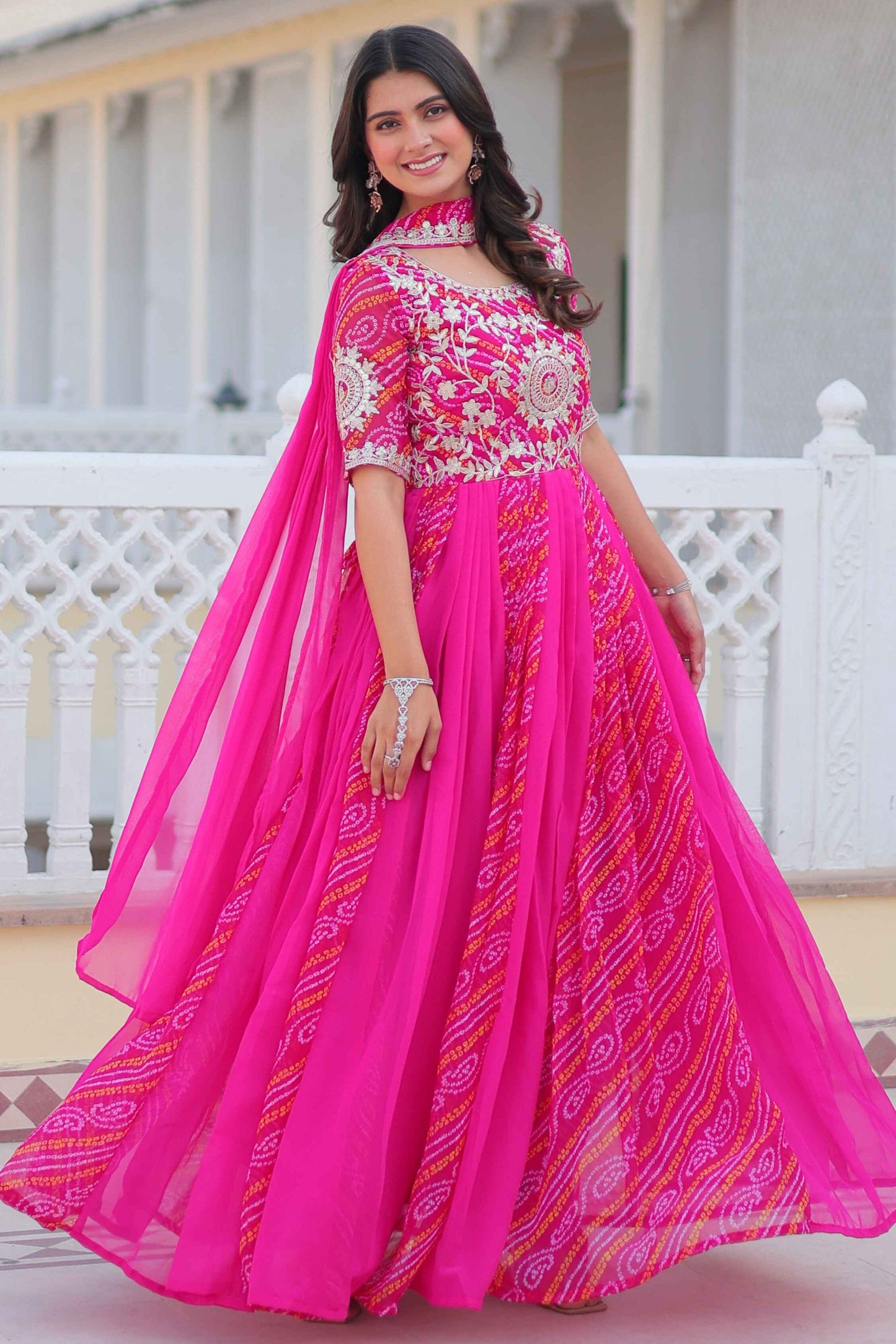 Tantalizing Rani Pink Bandhej Print Georgette Gown With Dupatta