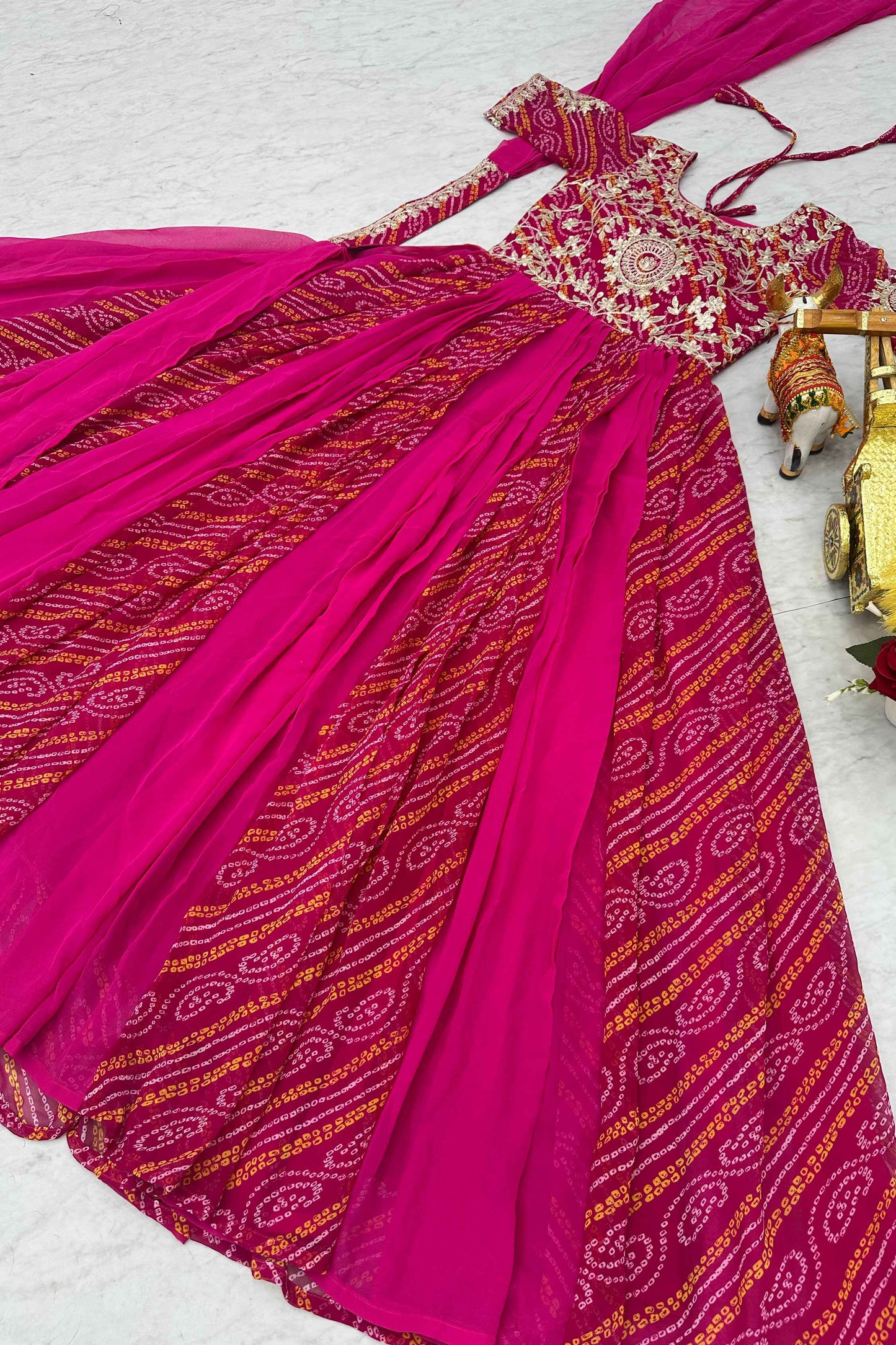 Tantalizing Rani Pink Bandhej Print Georgette Gown With Dupatta