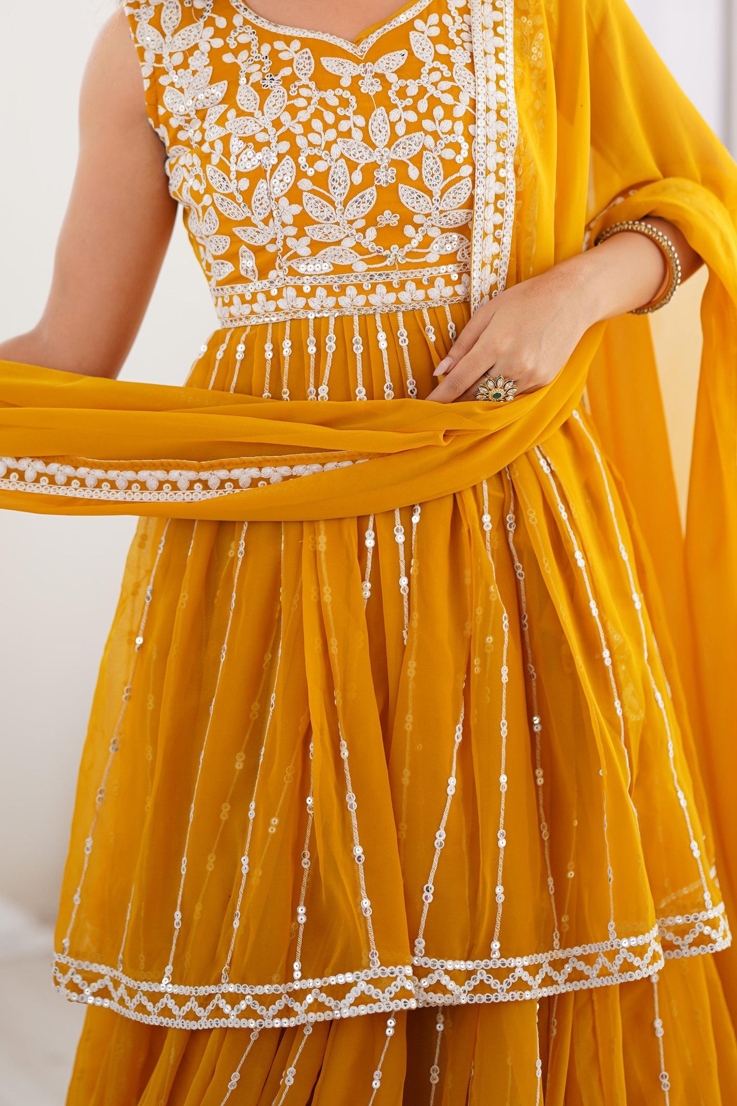 Charming Yellow Sequins Georgette Haldi Wear Peplum Top Lehenga